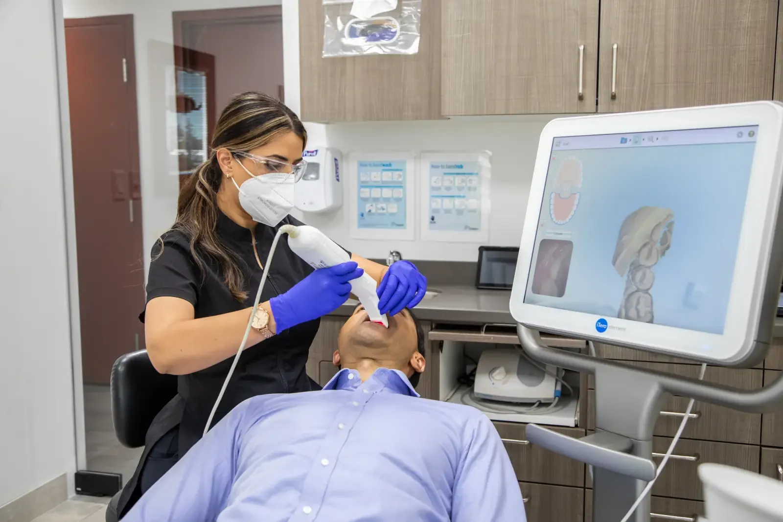 A Belman Dental Centre team member using the iTero Element intraoral scanner